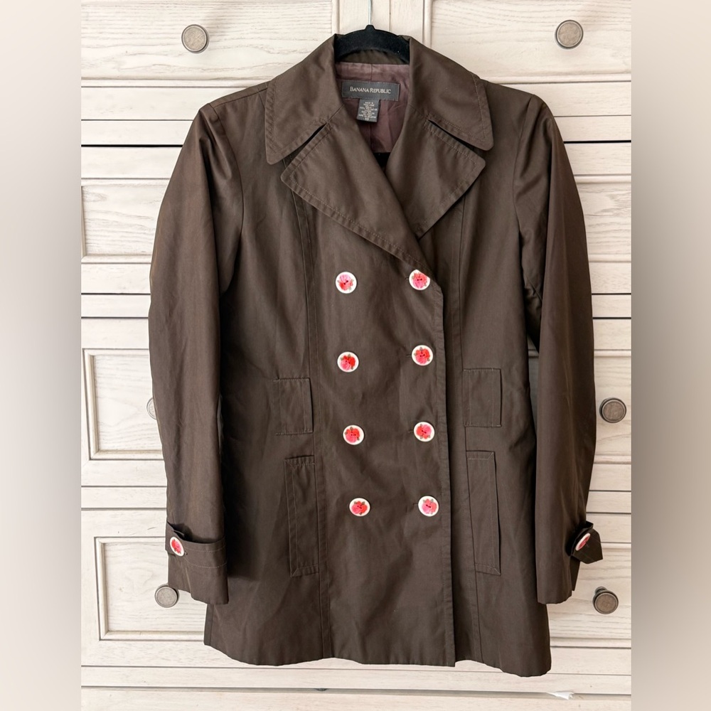 Banana Republic is a brown double-breasted blazer with Pockets